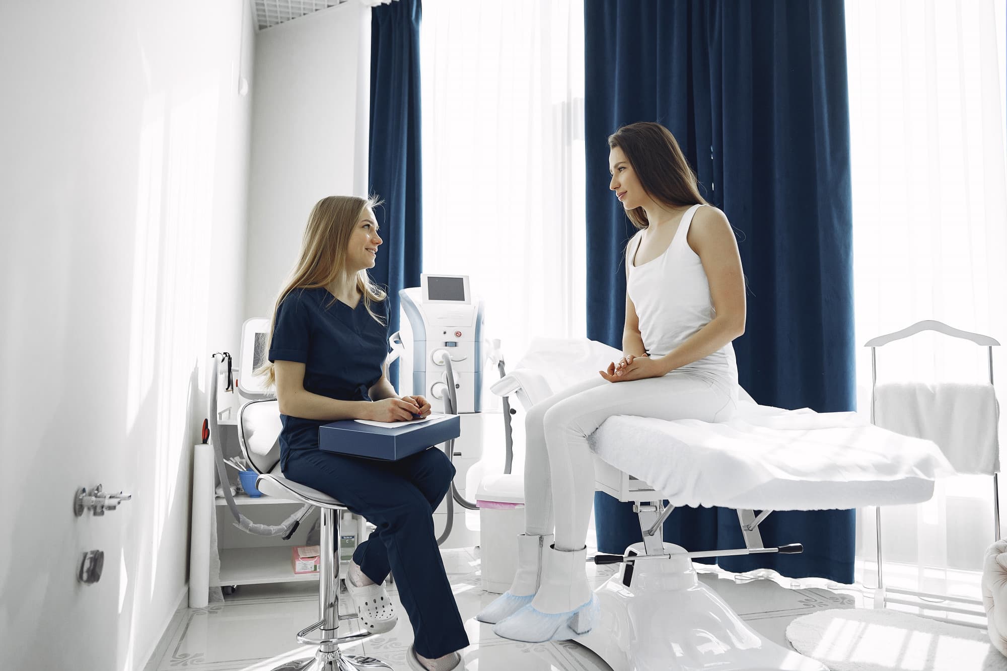 Dr Ellie Sateei consulting a patient at the clinic